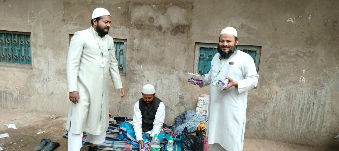 Founder distributing essentials to community members